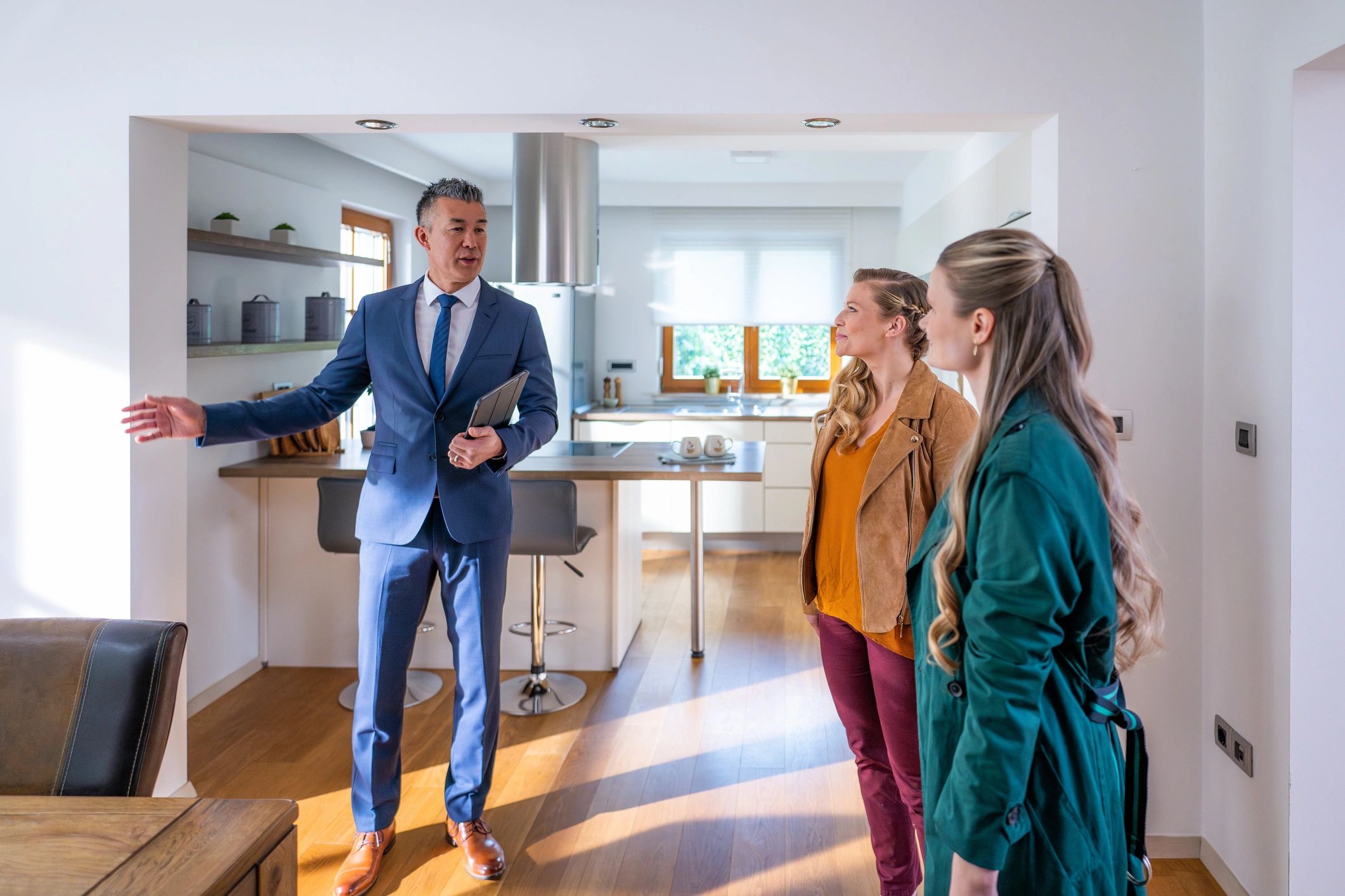 Real estate agent showing buyers a home