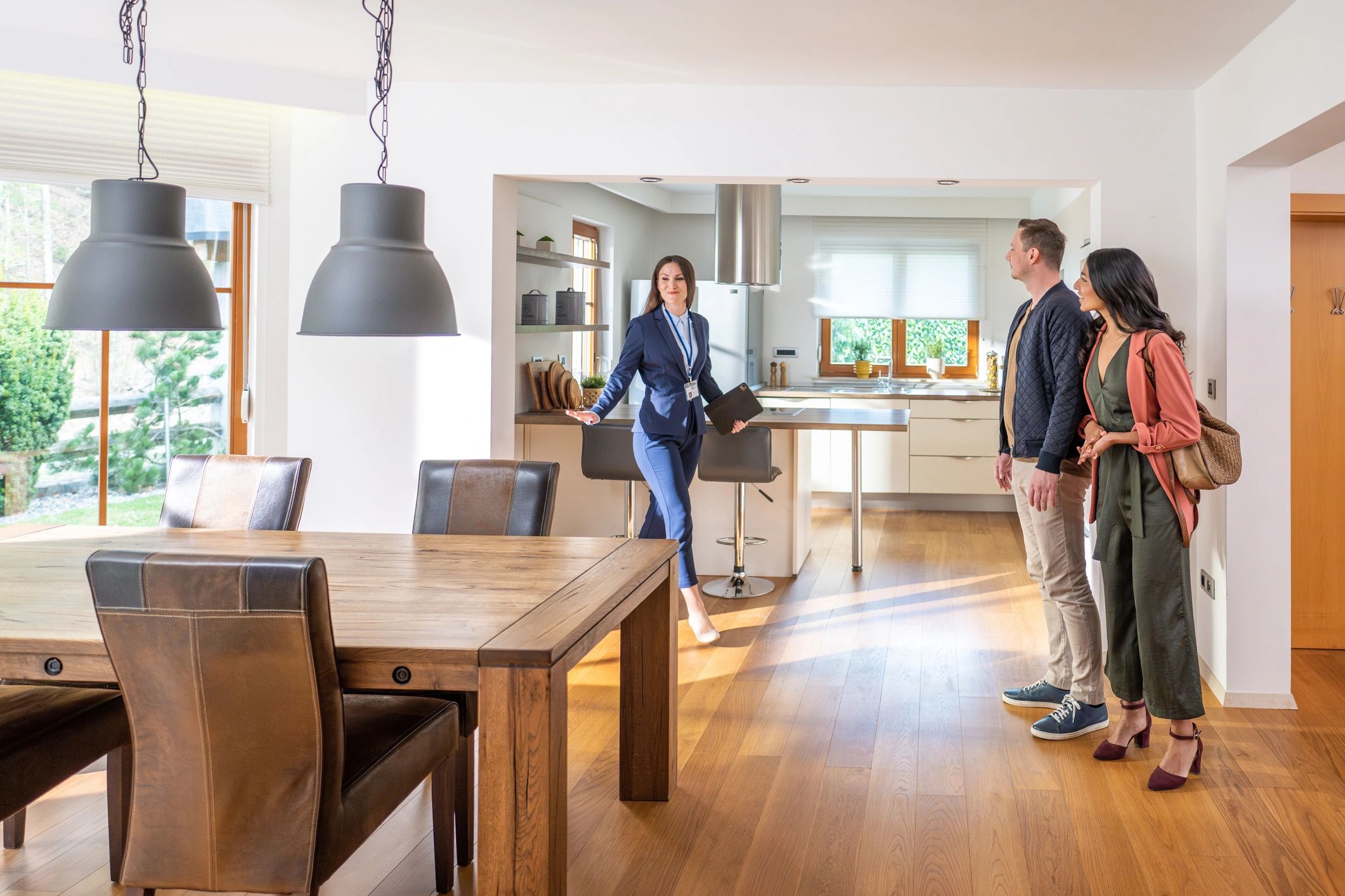 Real estate agent meeting with clients in a bright home